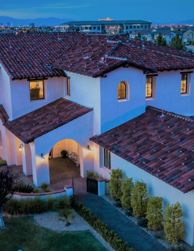 An aerial view of a home at dusk.