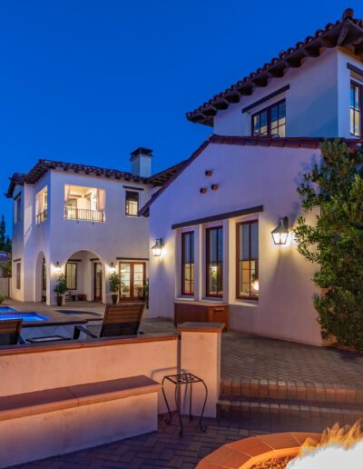 A home with a fire pit in the backyard.