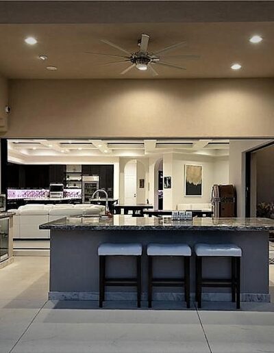 A kitchen with a large island and counter tops.