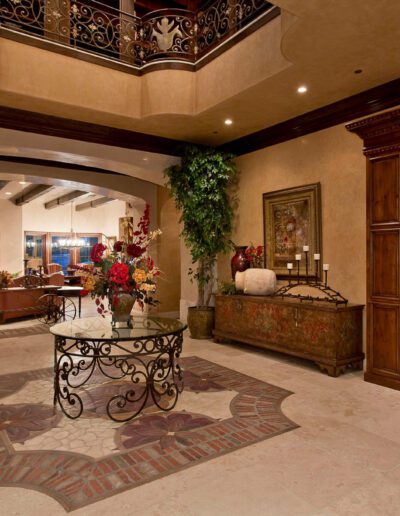 An ornate entryway with a staircase.