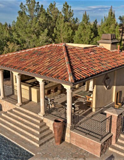 An aerial view of a swimming pool and patio.