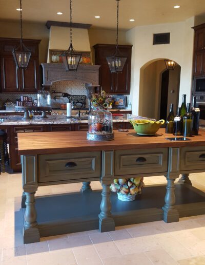A kitchen with a large island in the middle.